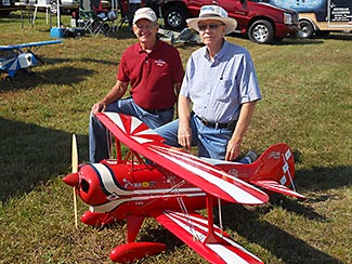 George Bassett on the left and Bob Bailey on the right with George's Pitts that Bob built in 1976. Bob flew the plane a few times and then sold it to Cliff Bennett of B&B Specialties. Cliff had a bad cross wind crash and George bought the plane from Cliff and put it back in flying condition. It was great to get Bob and the Pitts back together after all these years.
